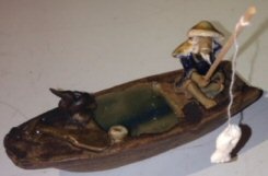 Ceramic Figurine Fisherman On A Boat Fishing With Duck