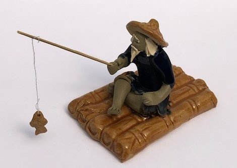 Miniature Ceramic Figurine Glazed Fisherman Sitting On Raft 2.75"