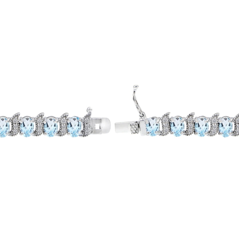 Sterling Silver Blue Topaz 6X4mm Oval And S Tennis Bracelet With White Topaz Accents