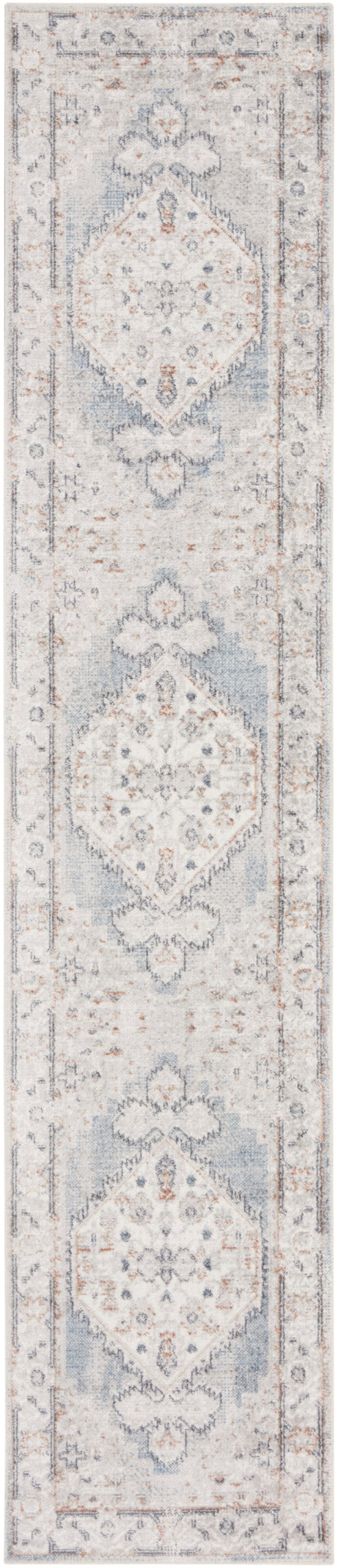 Astra Machine Washable Light Blue Vintage Area Rug